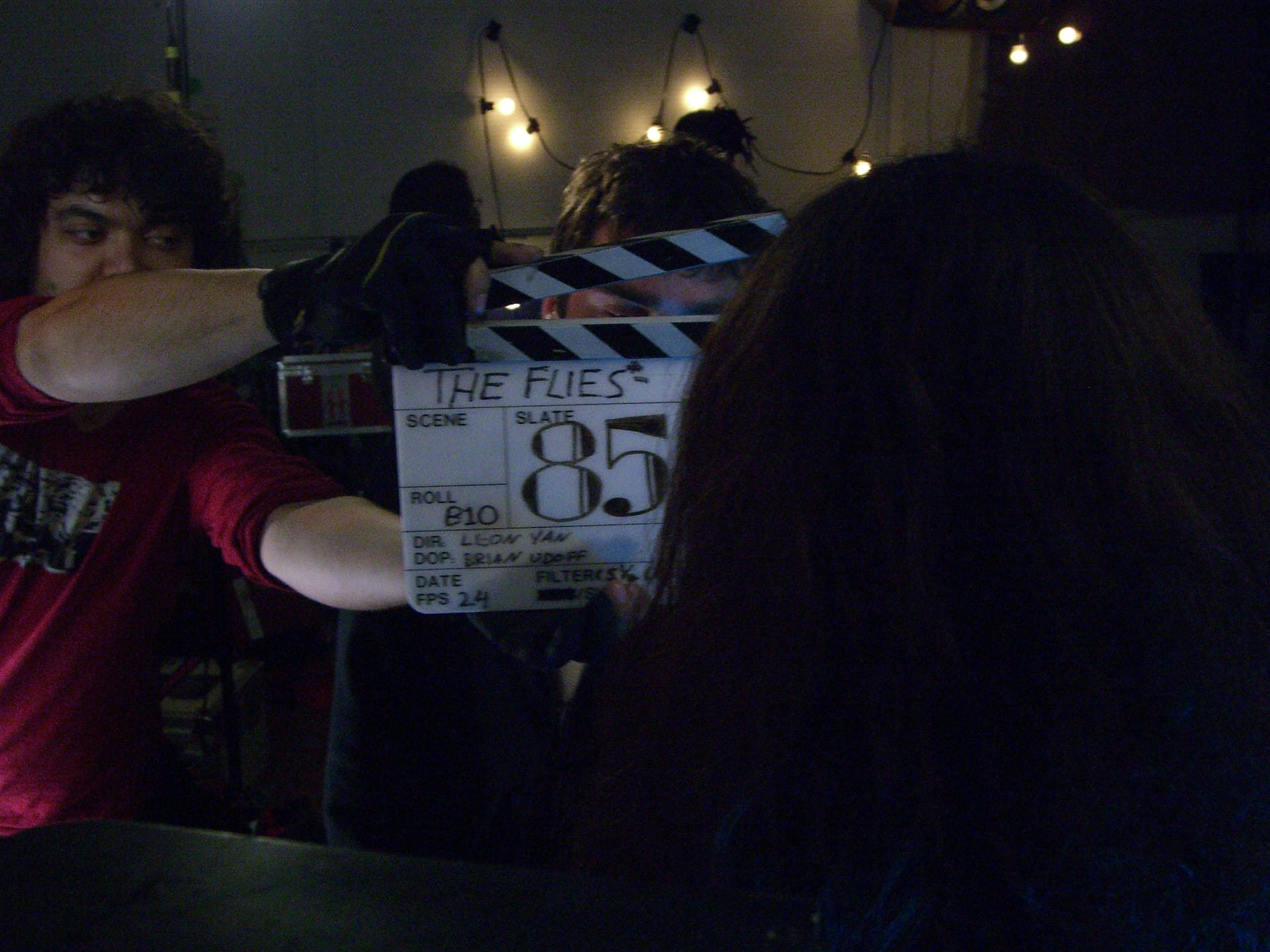 a director using a clapperboard